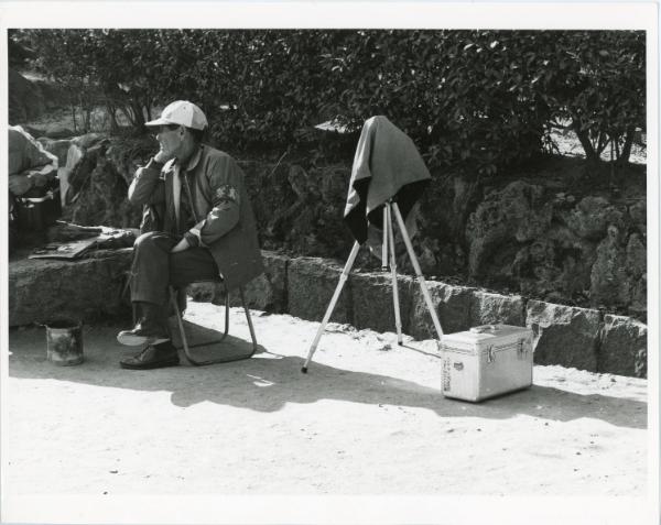 Man Sitting by Tripod, Japan, ca. 1970s