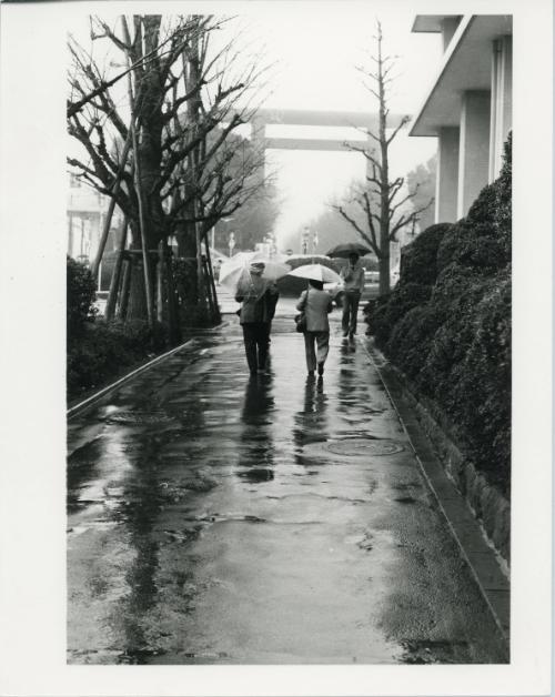 Men Walking with Umbrellas, Japan, ca. 1970s