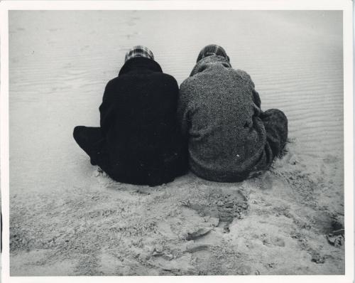 Two Men Sitting in the Sand, ca. 1970s