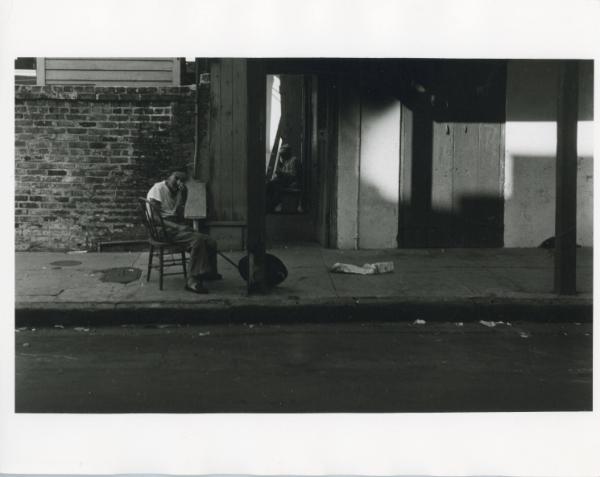 Woman Sitting in Chair on the Street, ca. 1970s