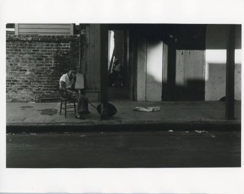 Woman Sitting in Chair on the Street, ca. 1970s