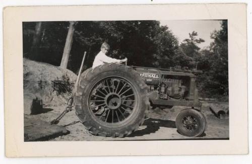 Boy on a Farmall Tractor 1