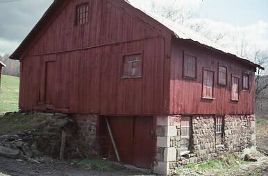 Red Barn With Stacked Stone Foundation