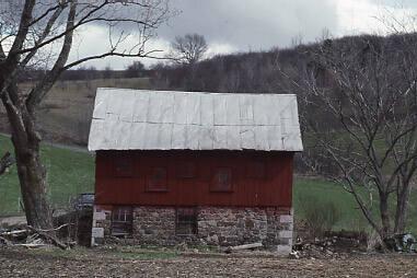 Red Barn With Stackes Stone Foundation 2