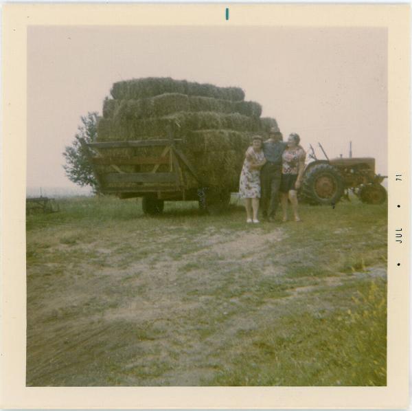 Two Women and a Man by the Wagon