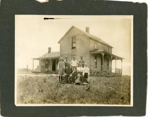 Family Portrait in Front of Home