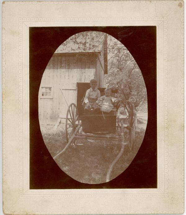 Two Children in a Buggy