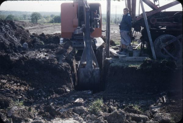 Backhoe Digging a Ditch