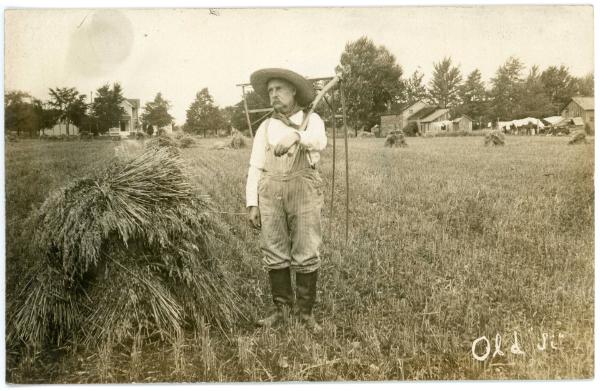 Man in a Field with a Scythe