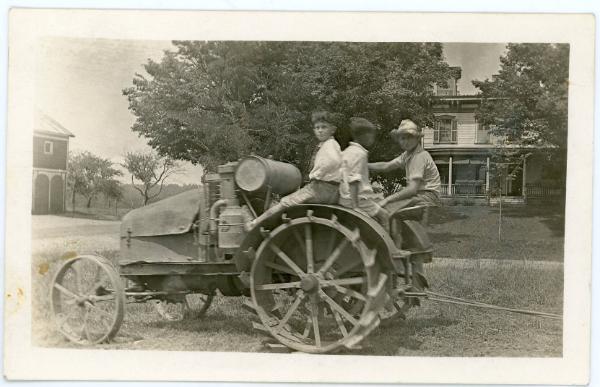 Three Boys on a Tractor