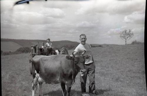 Man with Cow, Woman on Tractor