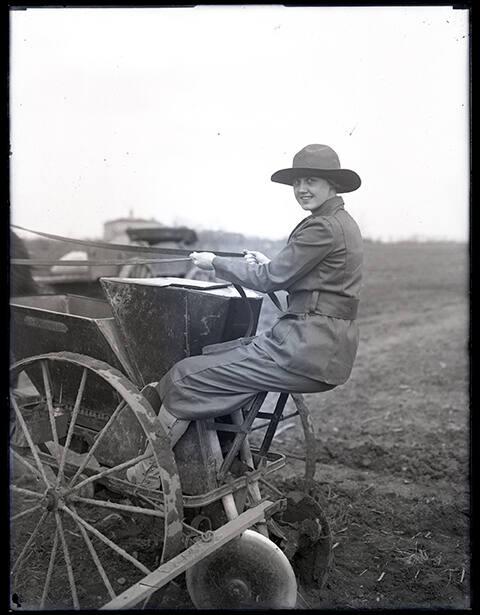 Woman on a Horse Drawn Seeder Machine