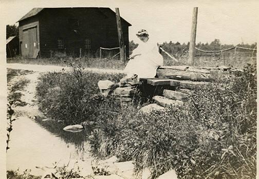 Woman Seated by Brook