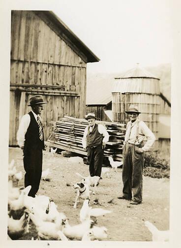 Three Men with Chickens 
