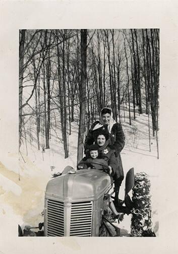 Two Women and a Boy on a Tractor 
