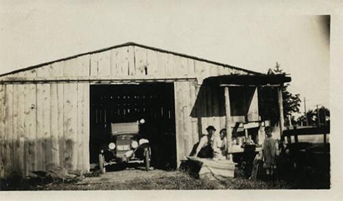 Family Posing by their Barn 
