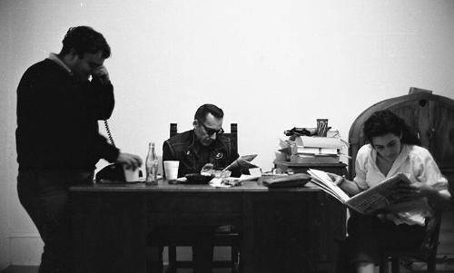 Portrait of Three People and a Desk