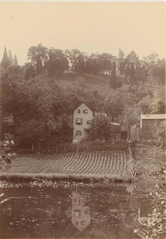 Farm at the Base of a Hill 
