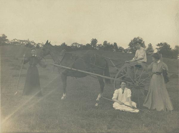 Man and Women with Dump Rake 
