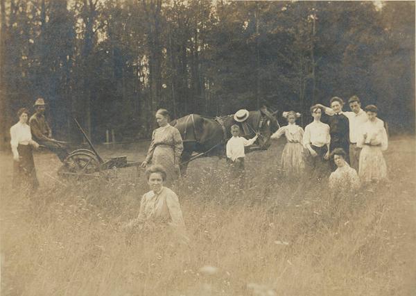 Doyle Family Members with Mower 
