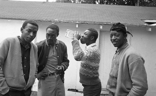 Four Men Outside a Building 1