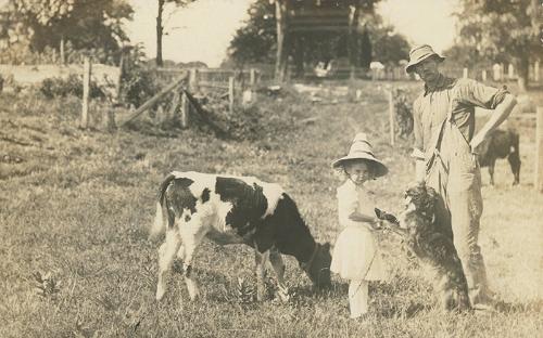 Girl, Man, Cow, and Dog 
