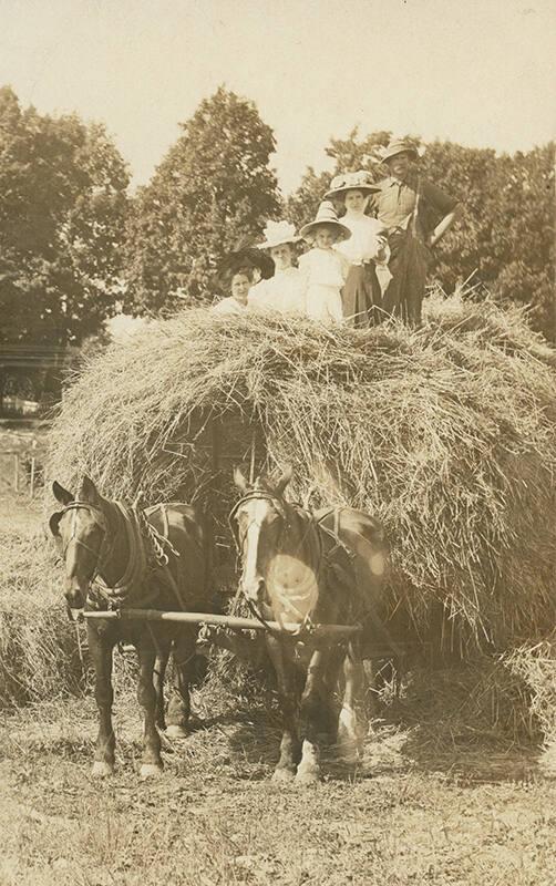 Women and Man on Haystack 
