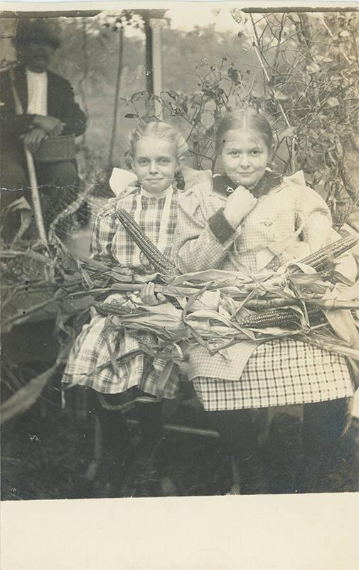 Two Girls with Corn 
