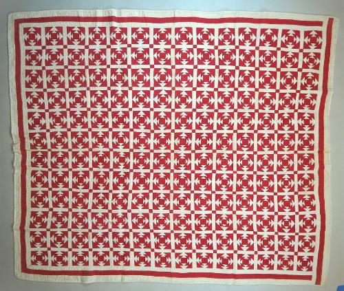 "Square on Square" quilt in red and white cotton. Each block is constructed with a small red sq…