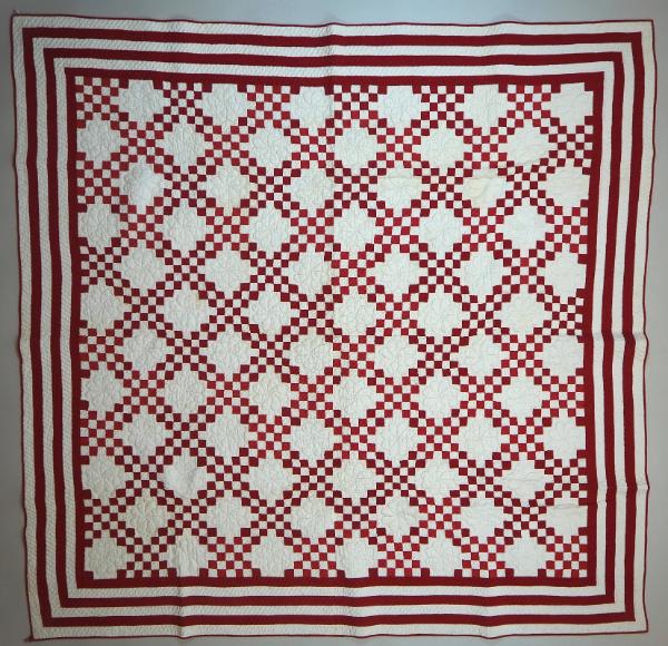 "Double Irish Chain" quilt in red and white cotton. The overall pattern consists of diagonal ro…