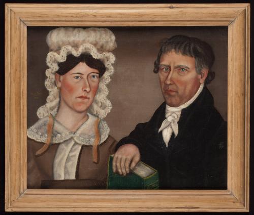 Woman and Man Holding Bible