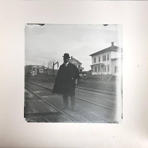 Man Standing on the Rail Road Tracks Intersecting East Main Street Milford, NY