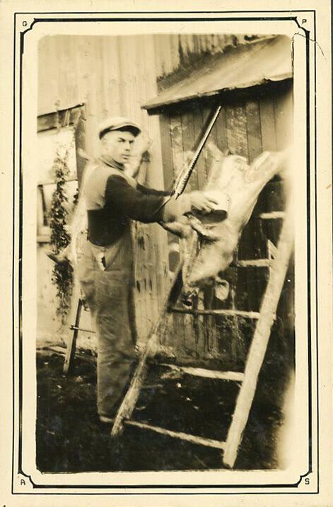 Man Prepping Pig 1