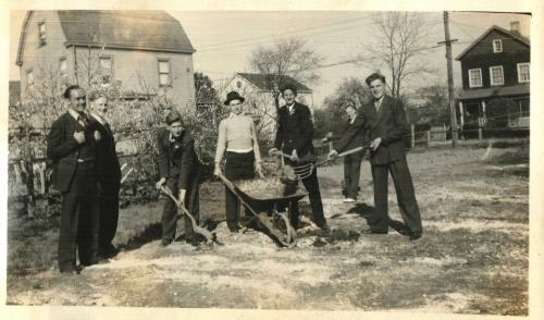 Pitching Hay in Suits