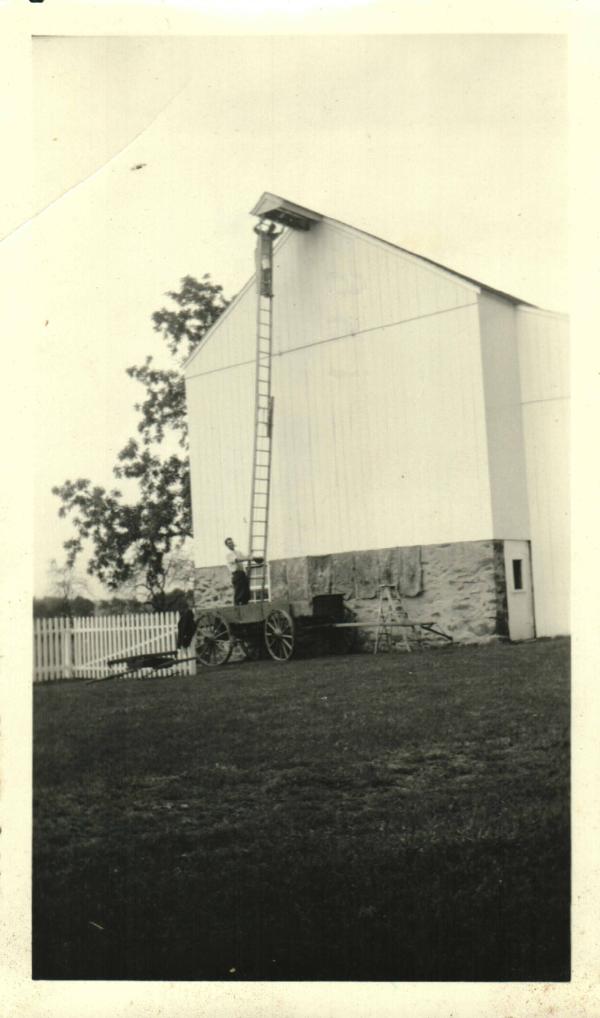 Men with Ladder to Barn