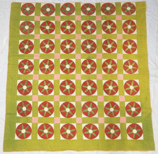 Combination patchwork, applique, and reverse applique quilt. Each block features a black-and-wh…