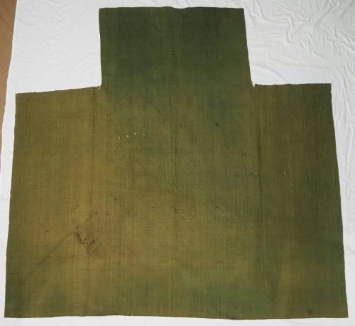 Whole-cloth quilt with green wool top and brown wool backing