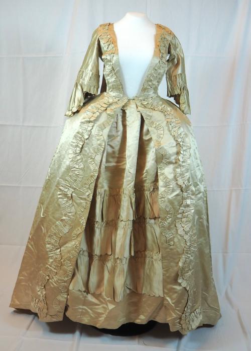 Front view of off-white satin sacque and petticoat.