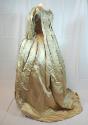 Side-back view of off-white satin sacque and petticoat.