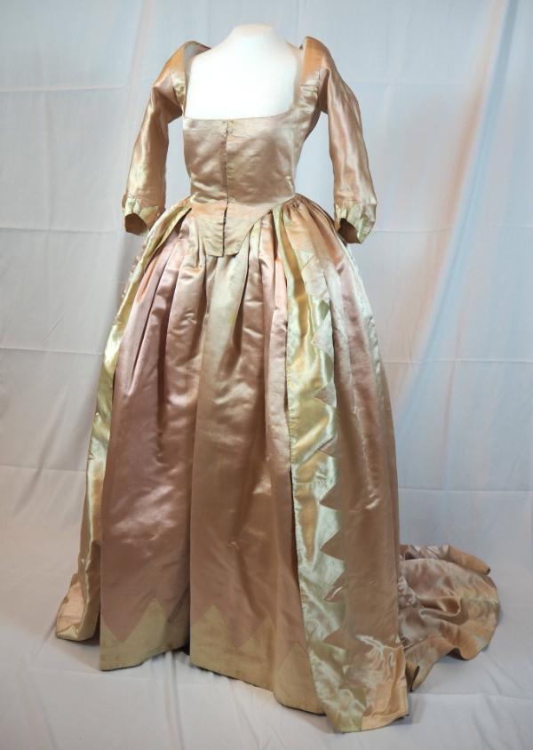 Pink satin gown and petticoat, seen from the front.