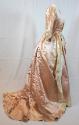 Pink satin gown and petticoat, seen from the side, with train pulled around to front.
