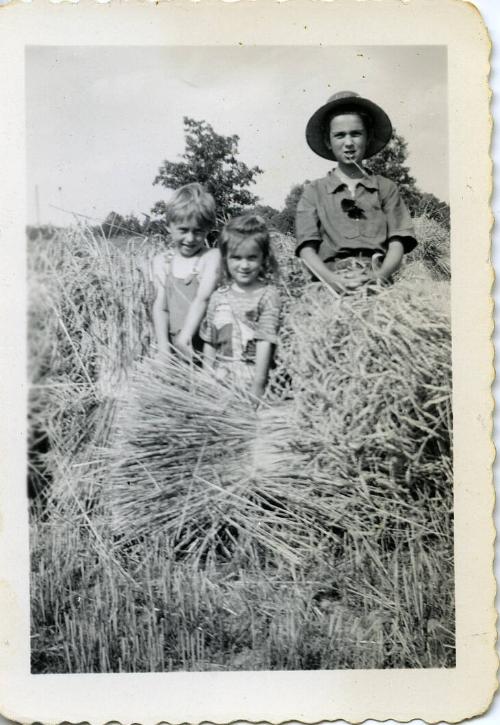 Dezemo Children Posing in a Haystack