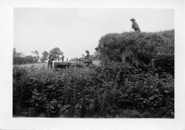 Tractor Pulling a Wagon of Hay