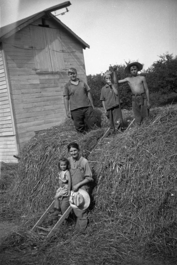 "Mama" Dezemo and Jim with Three Other Children in a Pile of Hay