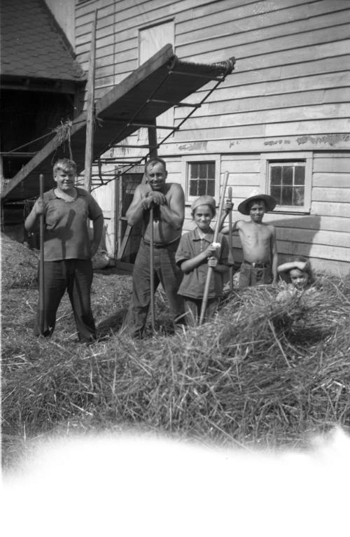 George, Anna and Myrtle Dezemo with Jim Working in the Hay