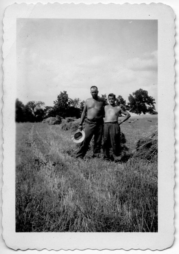 George Dezemo and Bob Young in a Hayfield
