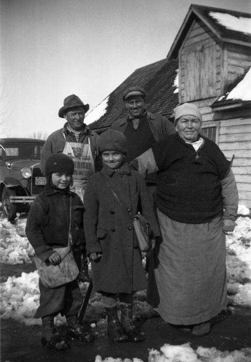 Five Dezemo Family Members Posing Outdoors in Winter