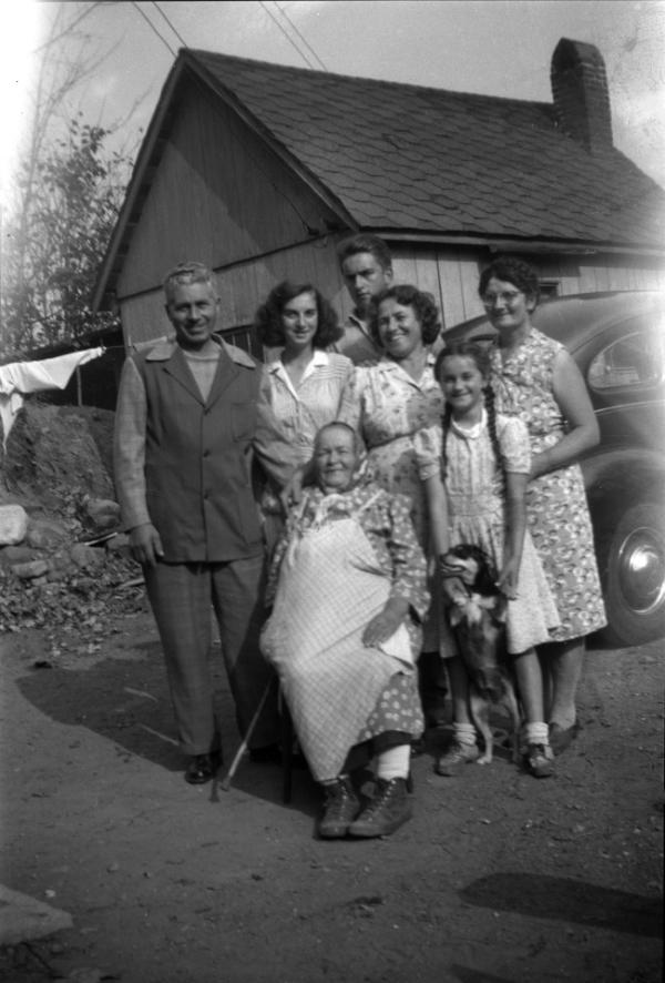 Grandma Dezemo with Family Members and a Dog