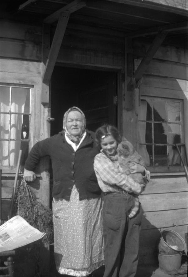 Grandma with a Young Girl and Cat