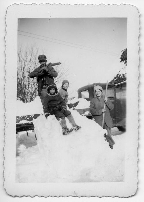 The Dezemo's Shoveling Snow